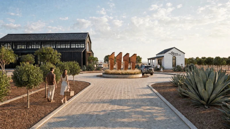 The arrival drive to an island with four corten-steel markers, the barn and the white farmhouse