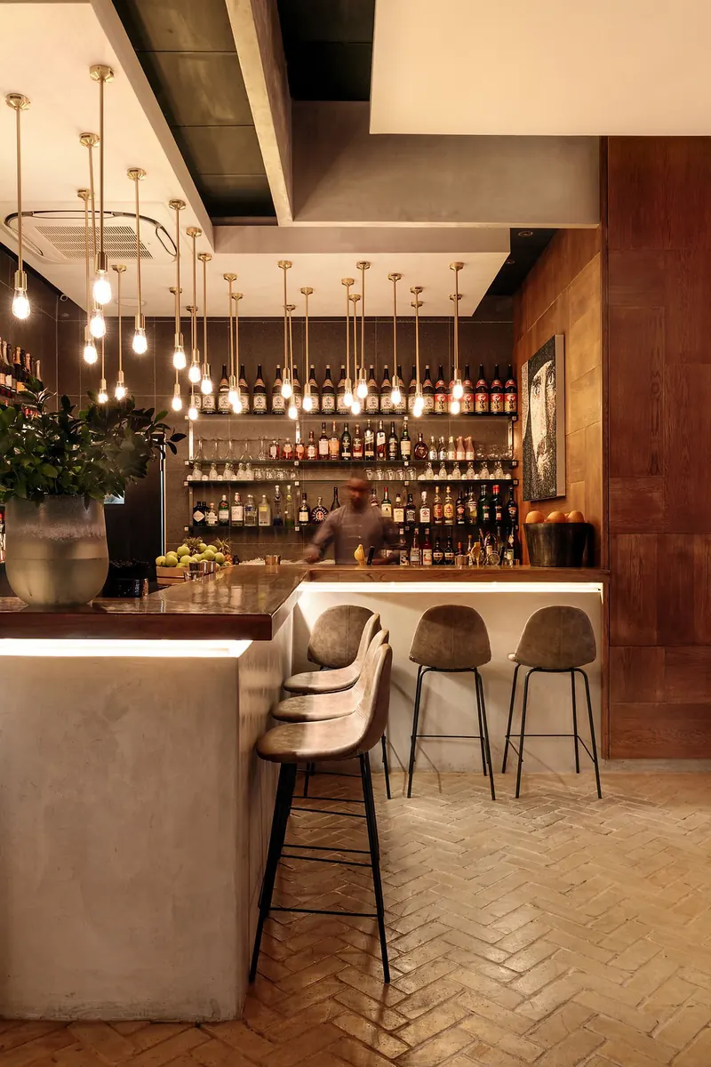 Sumi bar counter with pendant lights and stools